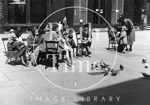 People watching the pigeons in Abbey Church Yard, Bath c.1942