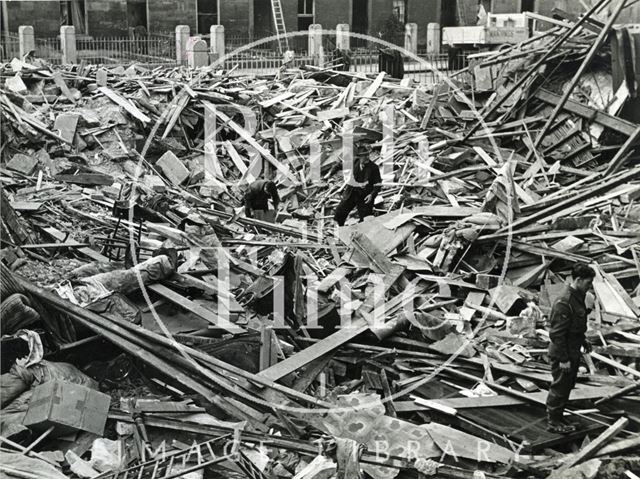 Searching for belongings in the bombed debris of Princes Buildings, Dolemeads, Bath 1941