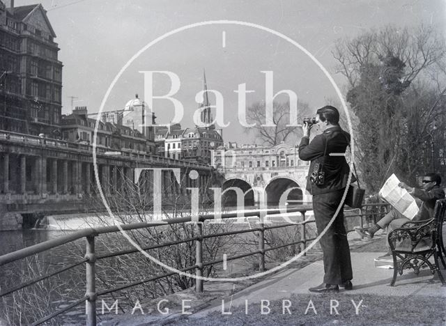 A photographer at work near Pulteney Weir, Bath 1960s