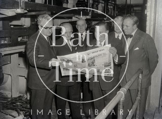 Reading the headline in BP News (Bath and Portland Group) 1960s