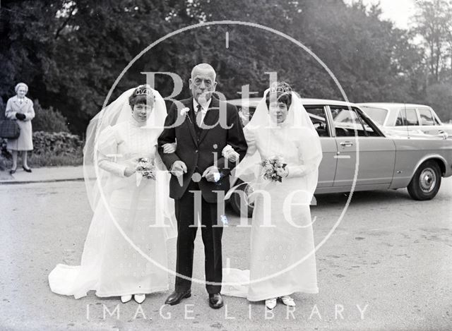 A proud father and most probably his twin daughters at their joint wedding c.1970