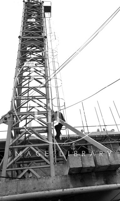 Adam Fergusson and Lord Snowdon climb down the tower crane at the Beaufort (Hilton) Hotel, Bath 1972