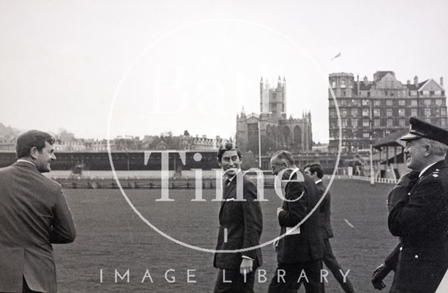 The Prince of Wales walks to his helicopter on the Recreation Ground, Bath 1972