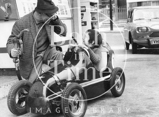 Pedal car at a petrol station, Bath c.1970