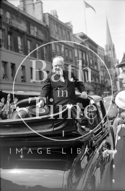 Winston Churchill in an open topped car outside the Guildhall, Bath 1950