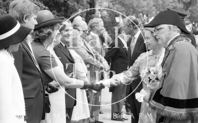 Mayor Raymond Charles Rosewarn guides the Queen down a line up during her visit to Bath 1977