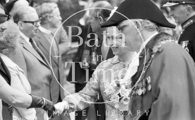 Mayor Raymond Charles Rosewarn guides the Queen down a line up during her visit to Bath 1977