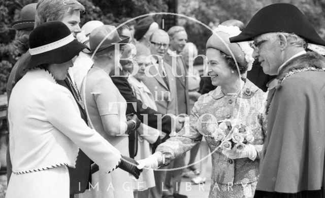 Mayor Raymond Charles Rosewarn guides the Queen down a line up during her visit to Bath 1977