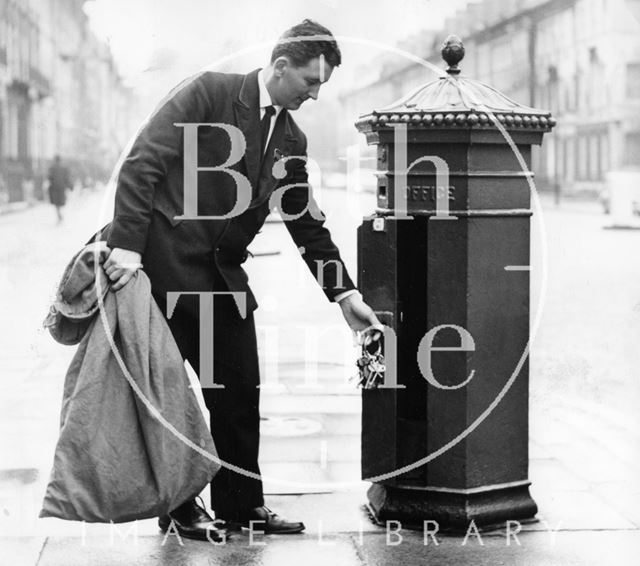 Postman Keith Costello collecting from the Emett-like post box in Great Pulteney Street, Bath 1970