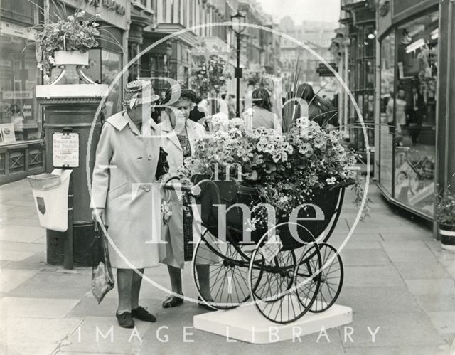 Examining an entry for the Bath in Bloom competition, Old Bond Street, Bath 1970