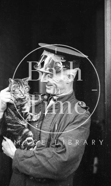 A rescue worker and cat 1942