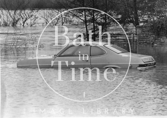 An abandoned car in Batheaston Car Park 1985