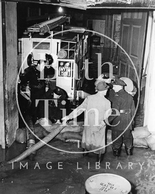 Sandbags and pumps at the electricity works, Dorchester Street, Bath 1960