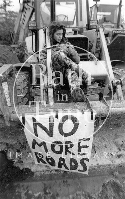 No more roads, a Batheaston/Swainswick Bypass protester is locked to a digger 1994