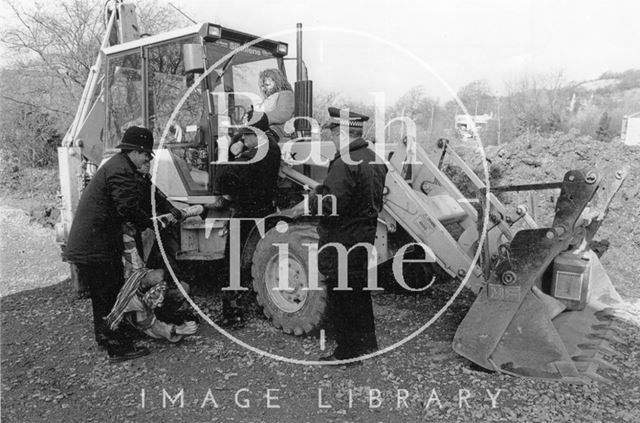 Policemen remove protesters from a digger, Batheaston/Swainswick Bypass 1994