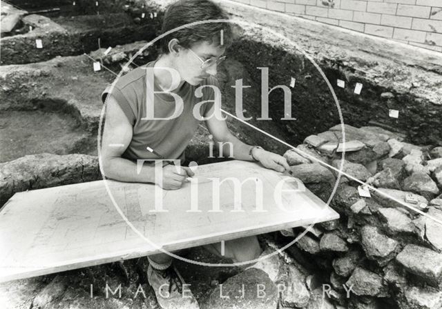 Marek Lewcun records the site during an archaeological dig at the Beau Street Baths, Bath 1989