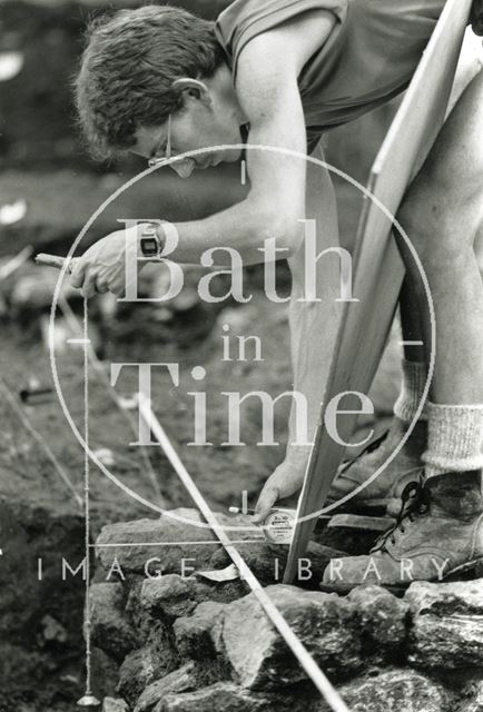 Marek Lewcun records the site during an archaeological dig at the Beau Street Baths, Bath 1989