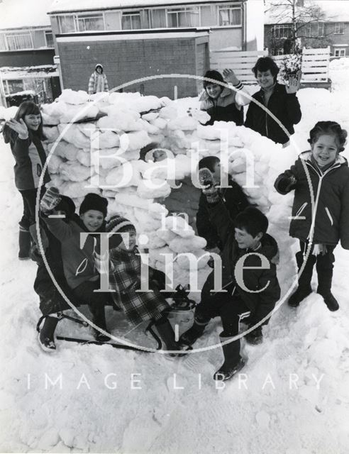 Children of Burford Close, Southdown, Bath playing in an igloo 1982