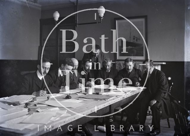 George Dafnis and men working at table, Bath c.1910