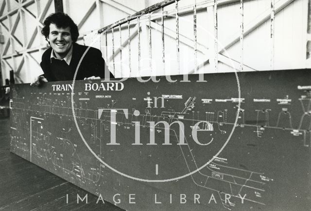 Railway enthusiast Simon Castens poses with a Train Board from the Somerset & Dorset Joint Railway 1993