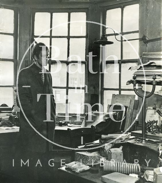 Russell Frears inside a gas lit office at Bowler's, Corn Street, Bath 1972