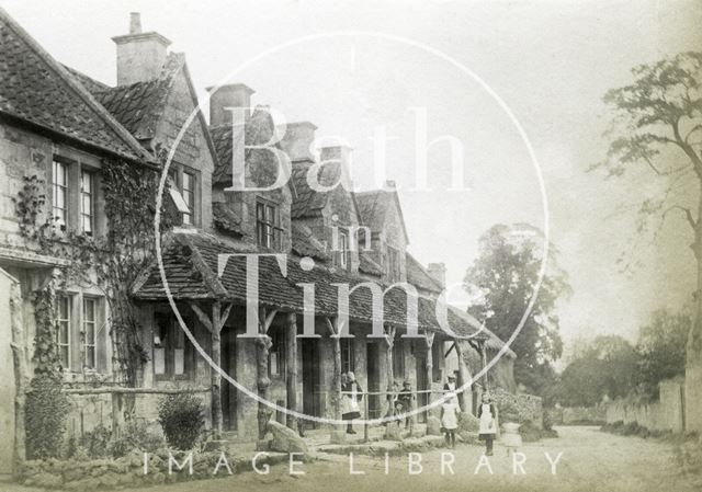 Children standing outside a row of cottages, Claverton c.1900