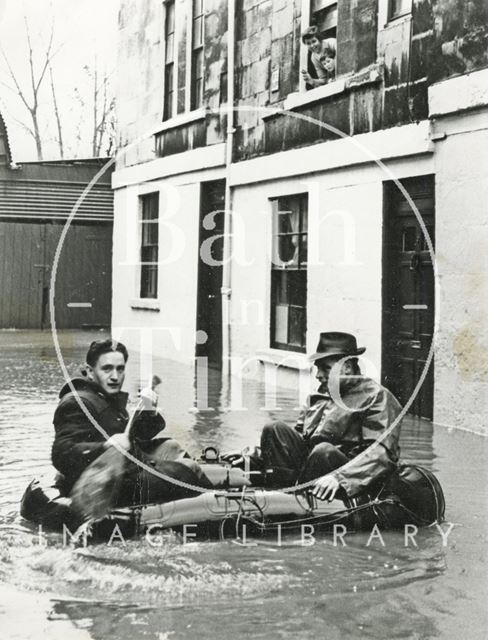 Paddling by in a dingy during the floods, Bath c.1960