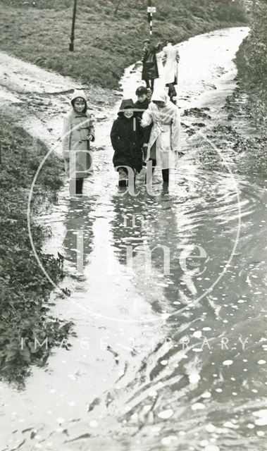 Children playing in the flood water in Weston, Bath 1960