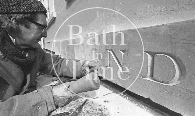 Architectural letter cutter Peter McLennan carving a street name, Old Bond Street, Bath 1987