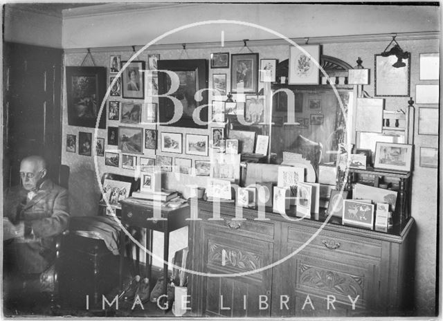 The Photographer's sideboard, self-portrait and pictures on wall c.1950