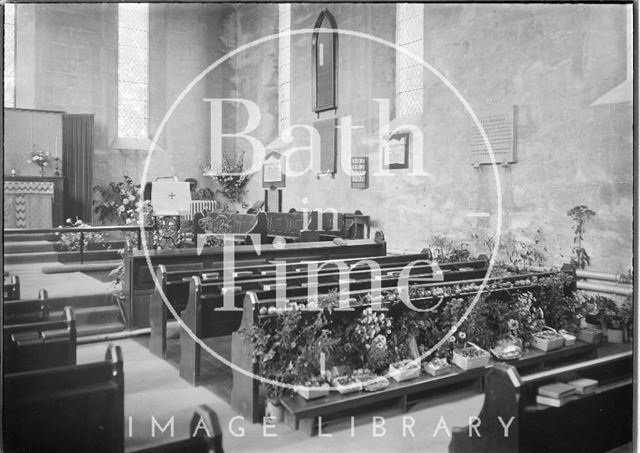 Interior of the chapel at St. Martin's Hospital, possibly decorated for harvest?, Bath c.1920