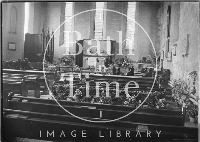 Interior of the chapel at St. Martin's Hospital, possibly decorated for harvest?, Bath c.1920