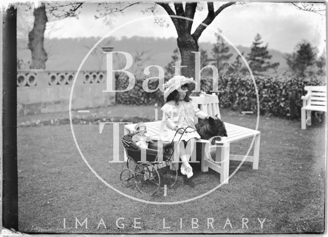 Young girl and toy pram, Monkton House, Warminster Road, Limpley Stoke, Wiltshire c.1910