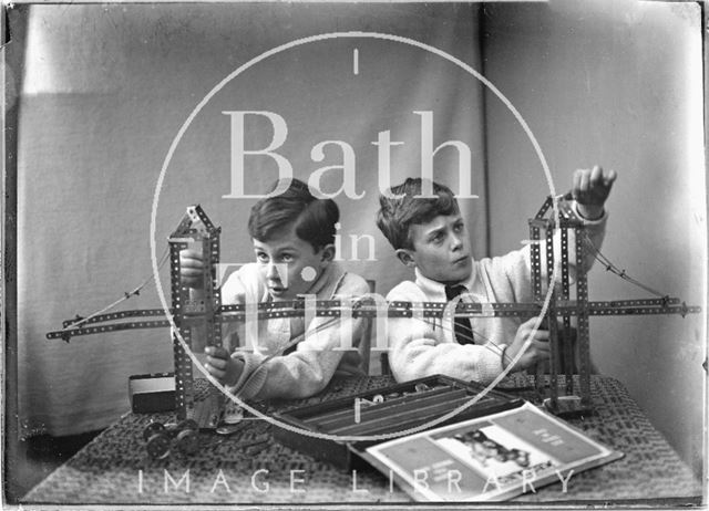 The photographer's twin boys playing with their Meccano set c.1923