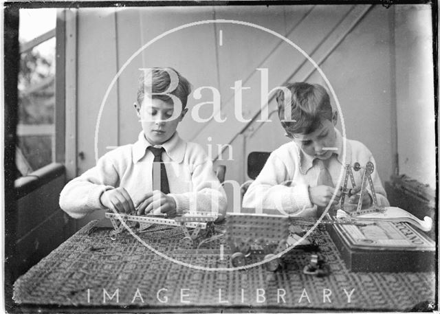 The photographer's twin boys playing with their Meccano set c.1923