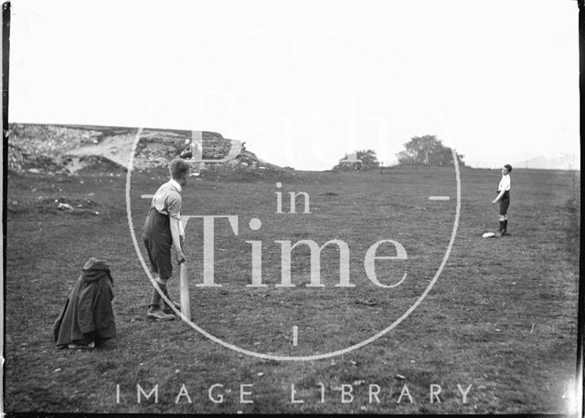 The photographer's twin boys playing cricket on Bathampton Down c.1919