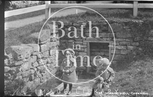 The photographer's twin boys at the Wishing Well, Conkwell, Wiltshire c.1912