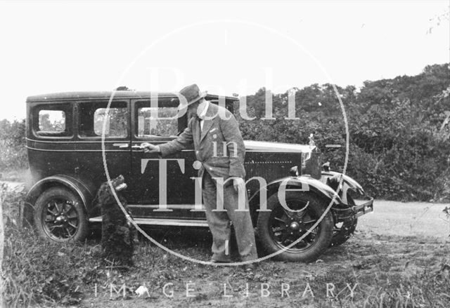 The photographer, his dog and car c.1920