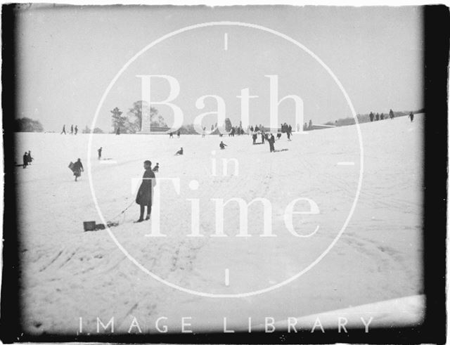 Tobogganing in the snow at Bathwick in the fields behind Sydney Buildings, Bath c.1920