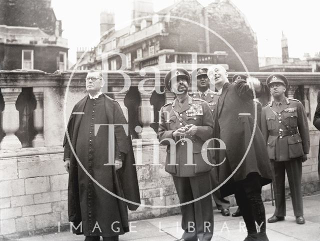 Haile Selassie looking up at Bath Abbey's tower 1954