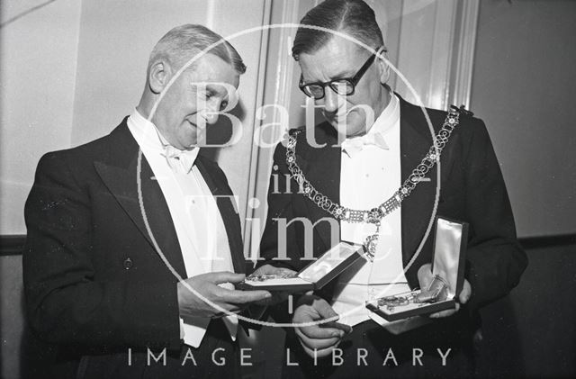 Mayor of Bath Cllr. Gallop and the City Clerk inspect the medals awarded to them by Emperor Haile Selassie 1954