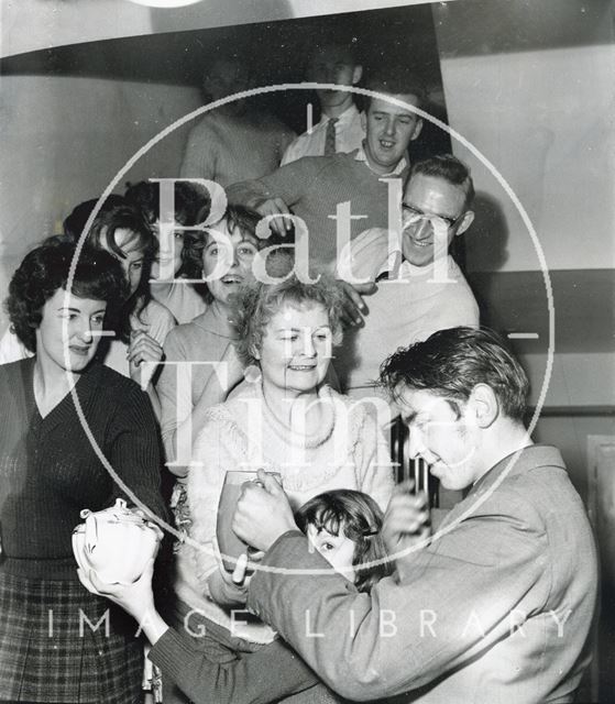 People having refreshments whilst sheltering from the flood, Bath 1960