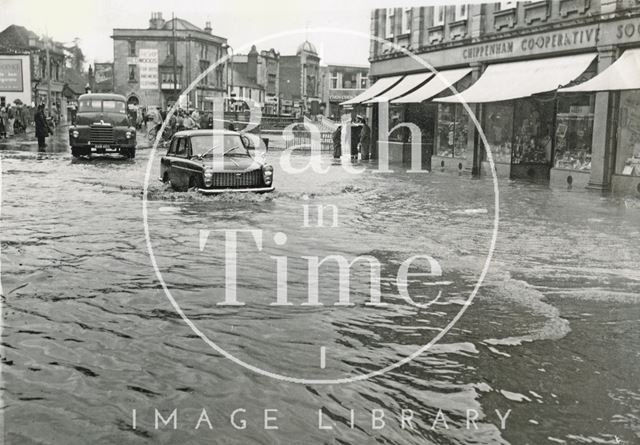 Waterlogged cars in a flooded High Street, Chippenham, Wiltshire 1960