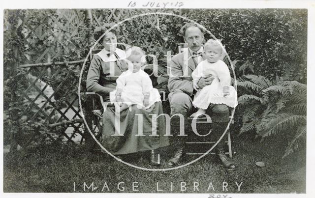 Violet and George Dafnis with their twin boys in their back garden, Bath 1912