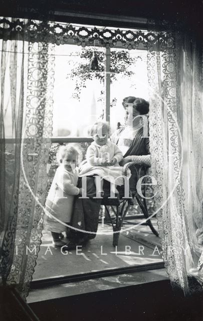 On the balcony of 32, Sydney Gardens, Bath the photographer's wife Violet and twin boys 1912