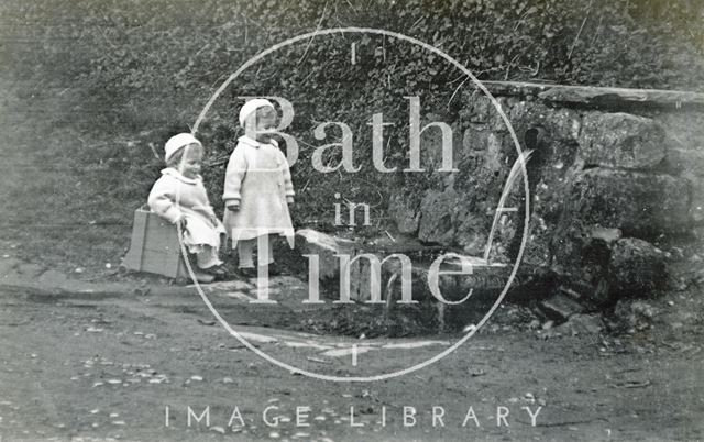 The photographer's twins at the wishing well, Horseshoe Walk, Bath 1913