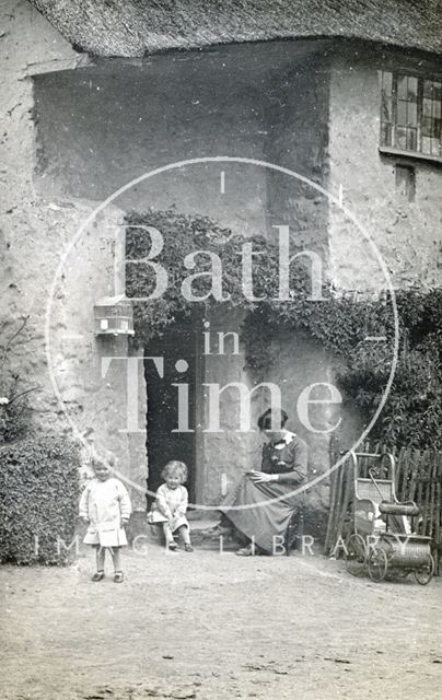 The photographer's wife Violet and twin boys outside most probably a holiday cottage near Minehead, Somerset c.1914