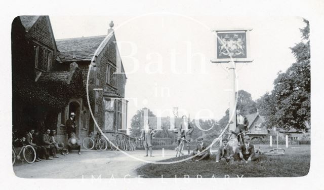 George Love Dafnis stands in the centre of this group shot of cyclists, outside the Lansdowne Arms, Derry Hill, Wiltshire c.1900