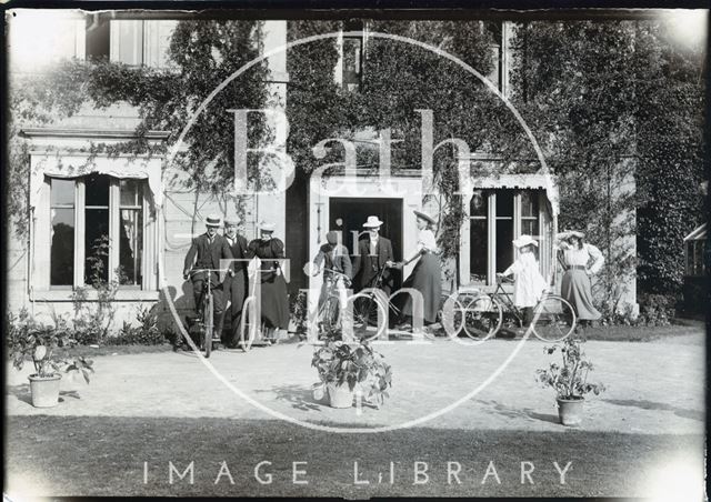 An Edwardian group with bicycles outside a grand by an unidentified house c.1892