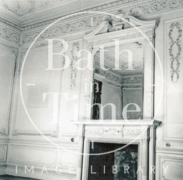 Fireplace and ornate mirror surround, east room, northwest wall, Wood House, Twerton, Bath 1964